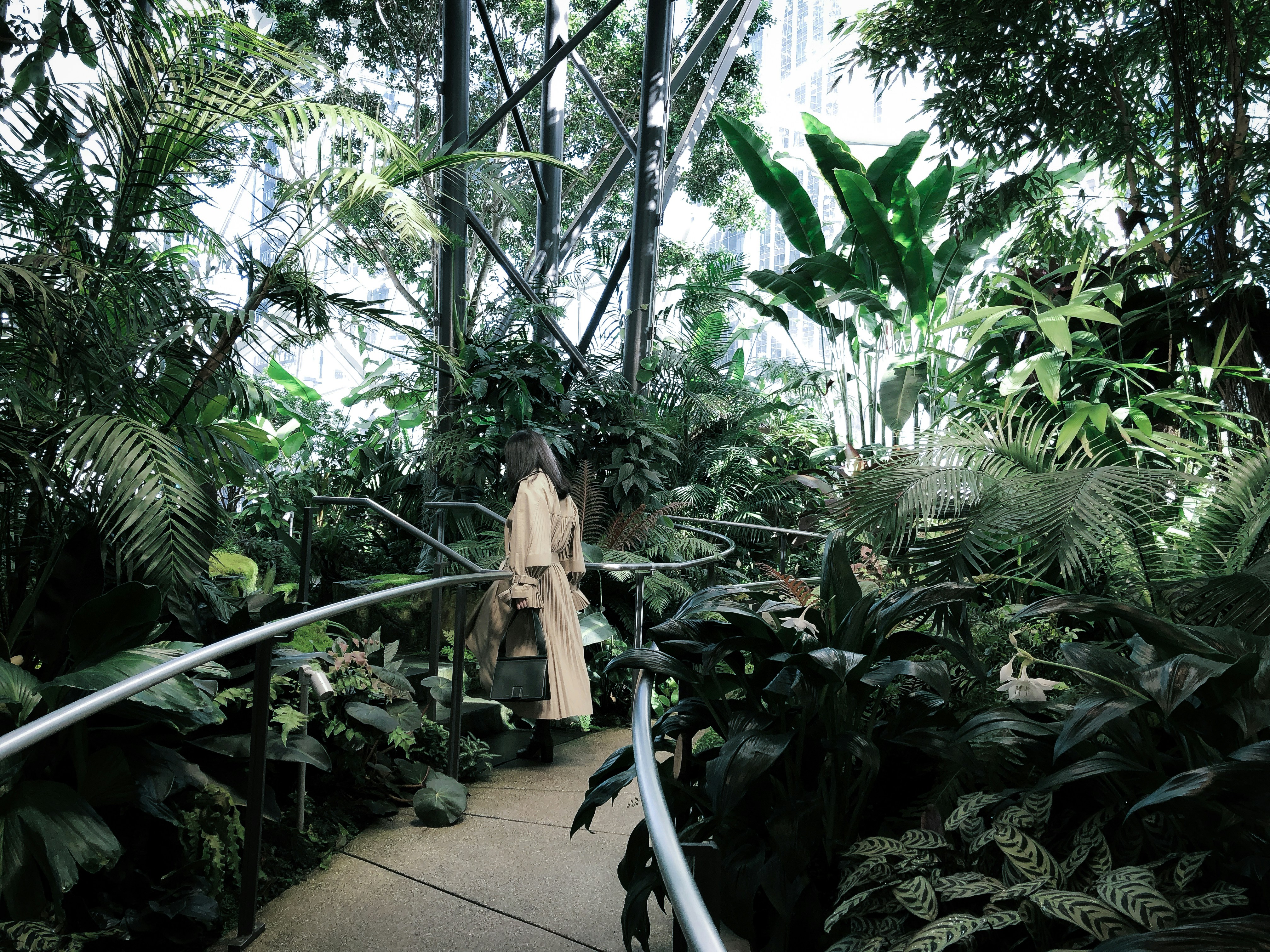 Woman Walking in Indoor Urban Garden