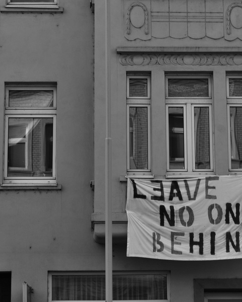 Protest Banner on Building Facade