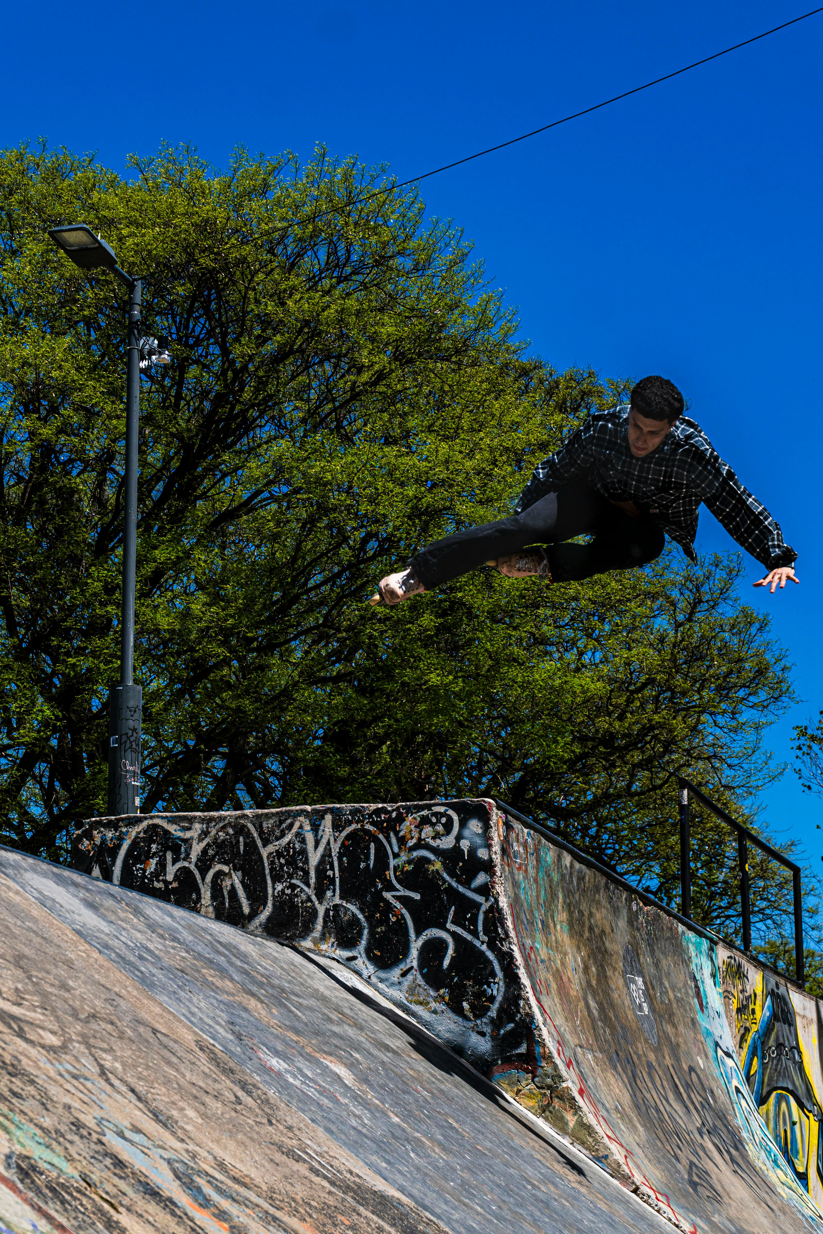 Skateboarder Mid-Air Trick at Skatepark