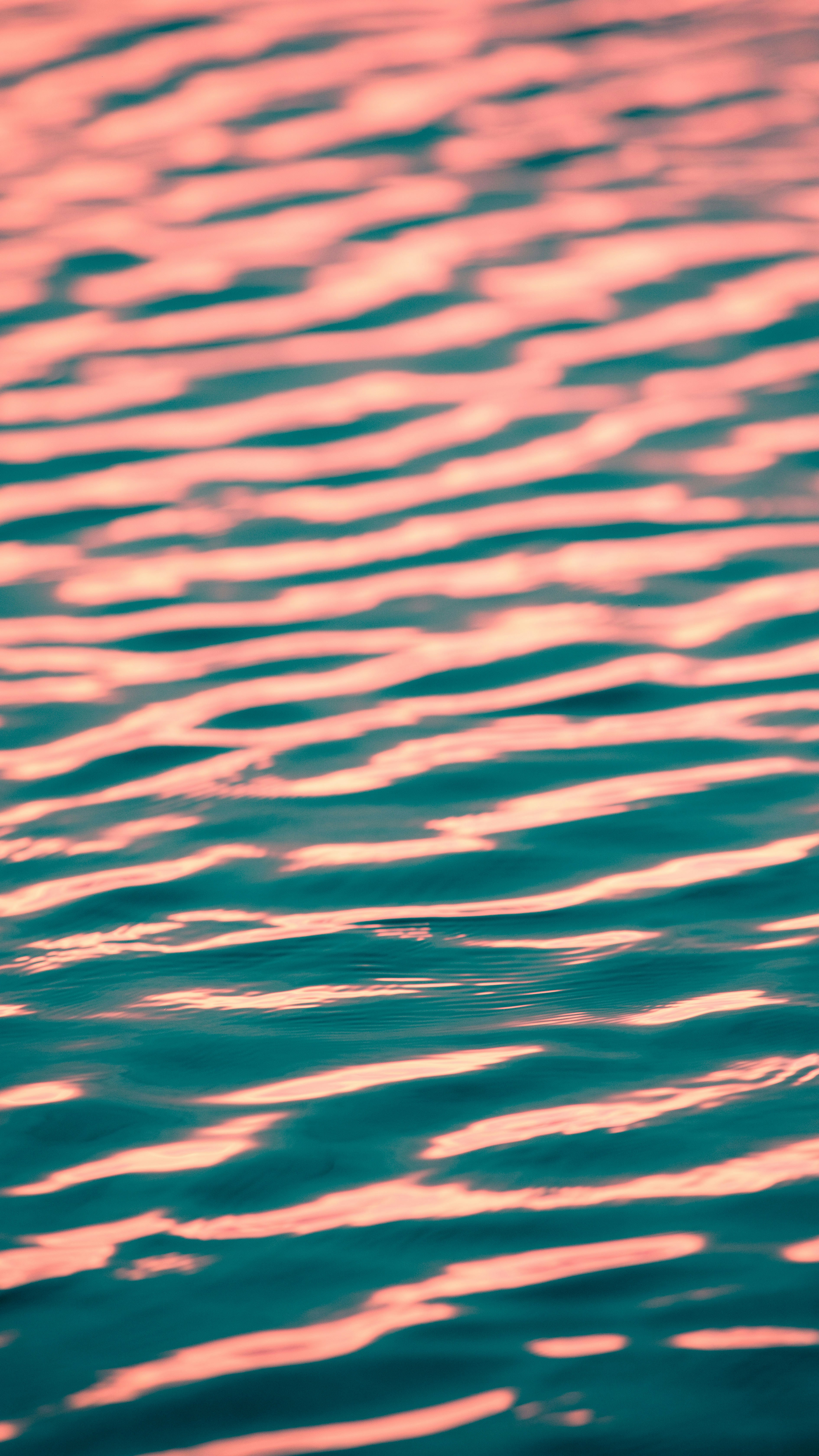 Pink Reflection on Rippled Water
