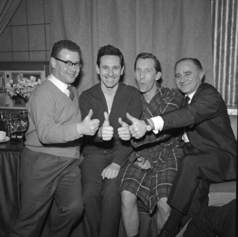 Four Men Giving Thumbs Up