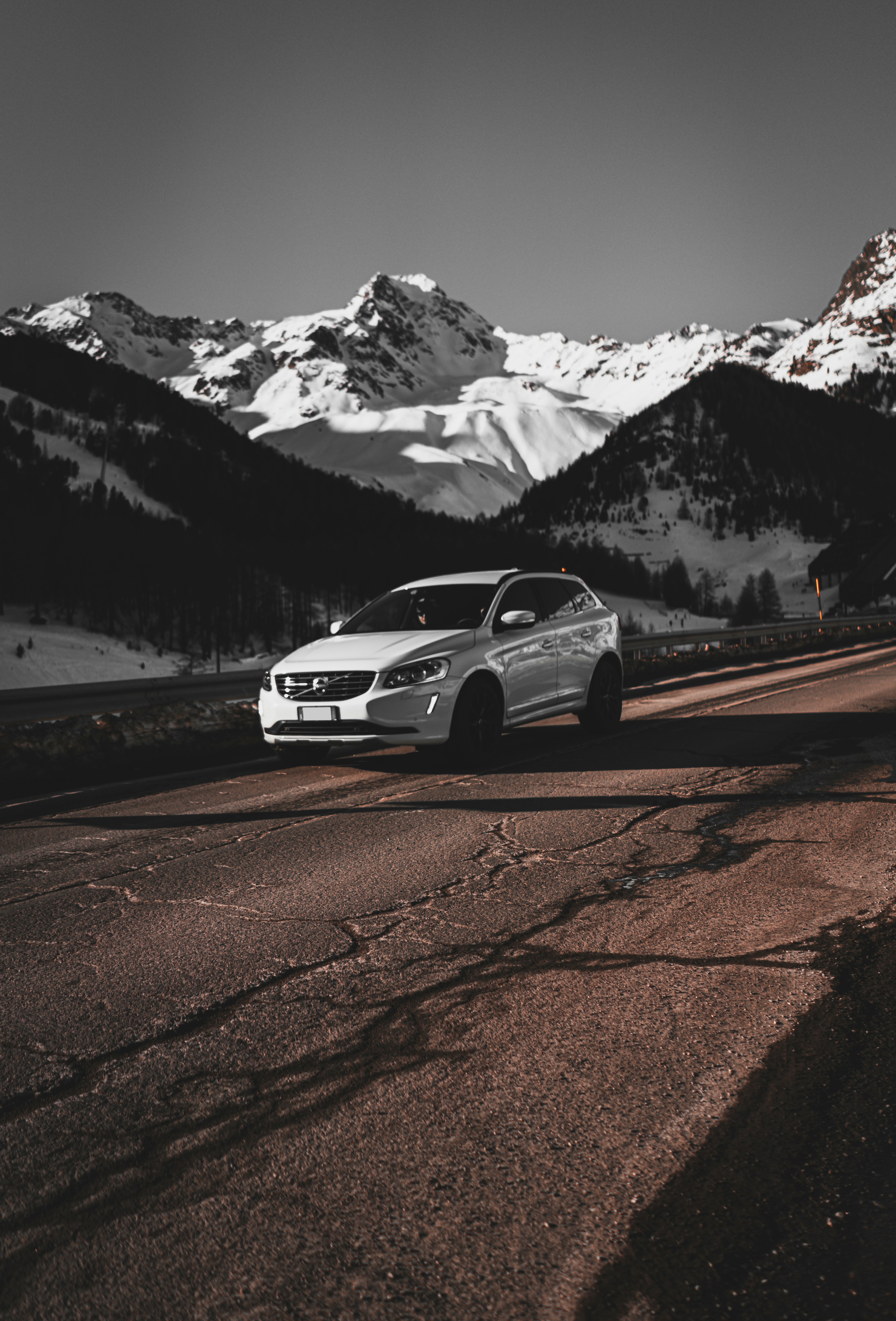 White Volvo On Snowy Mountain Road