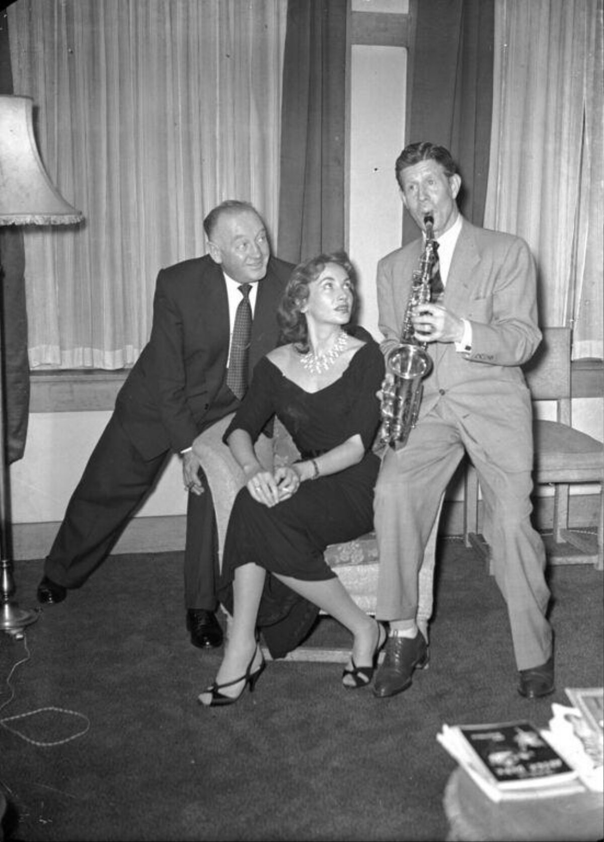 Three People With Saxophone Performance