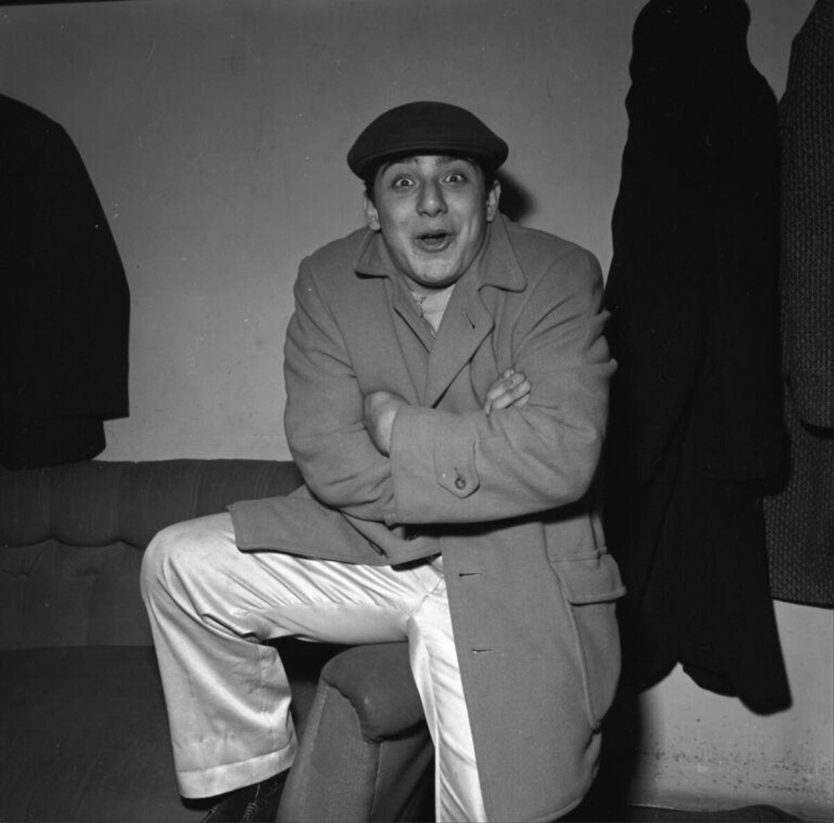 Surprised Man Posing on Sofa
