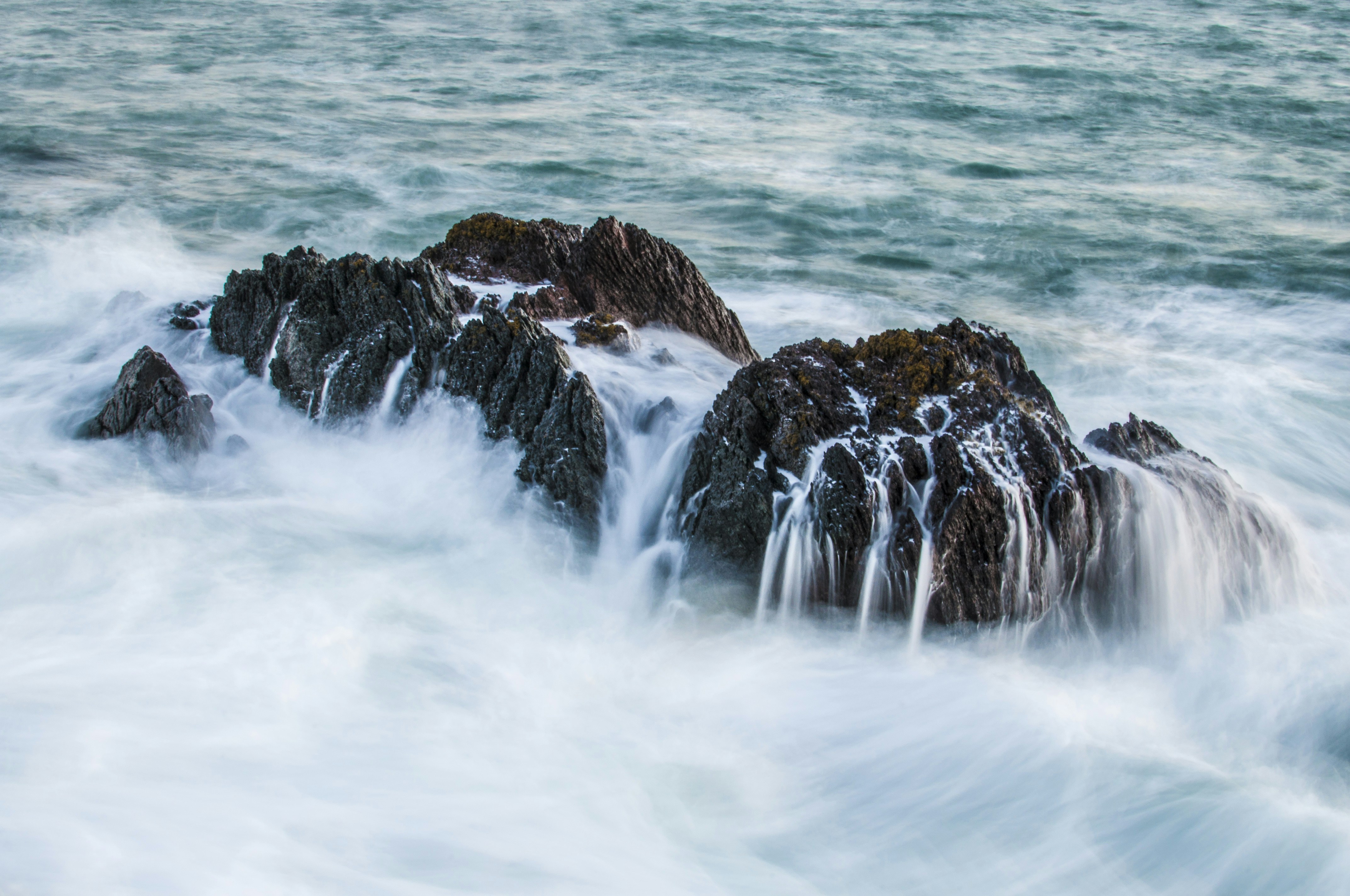 Waves Crashing on Coastal Rocks