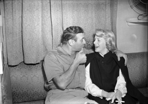 Man and Woman Chatting Laughing on Sofa