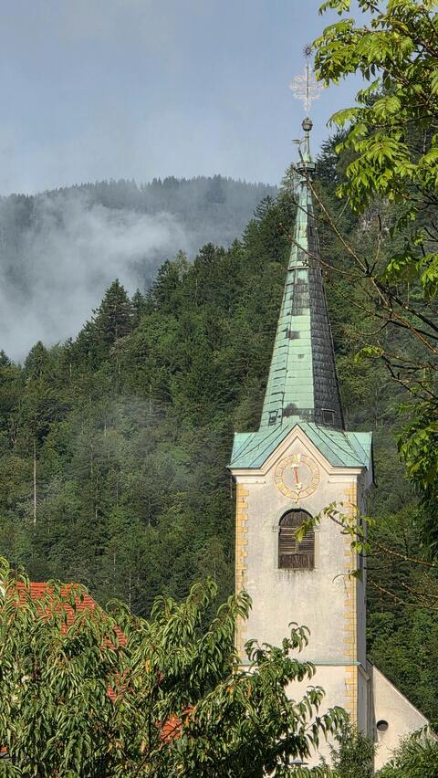 Church Steeple by Misty Forest Mountains