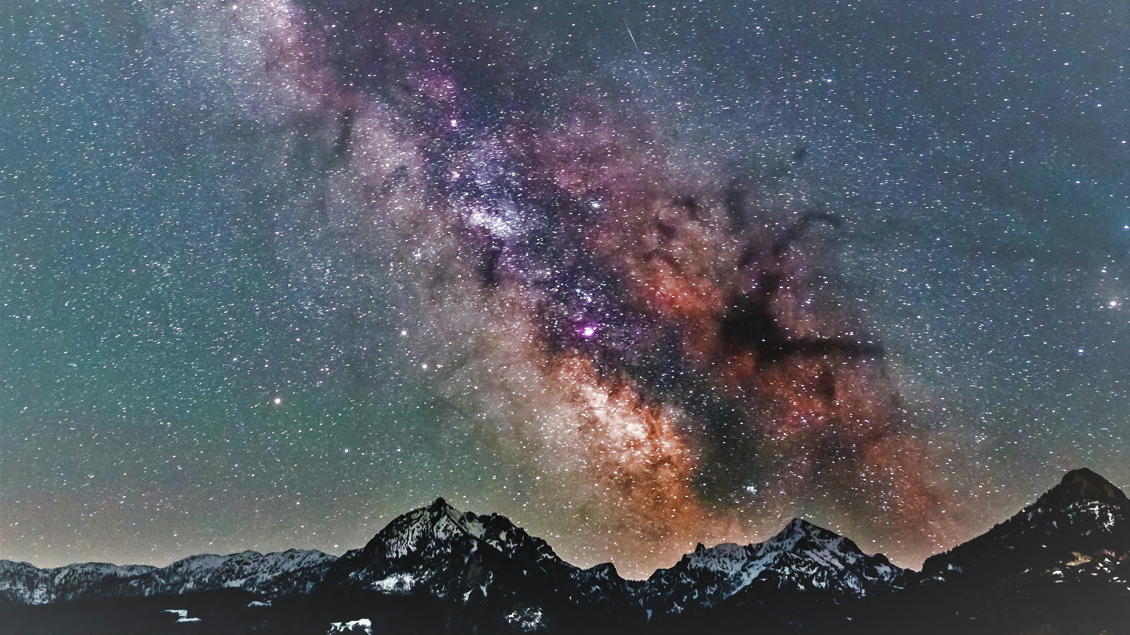 Milky Way Over Snow-capped Mountains