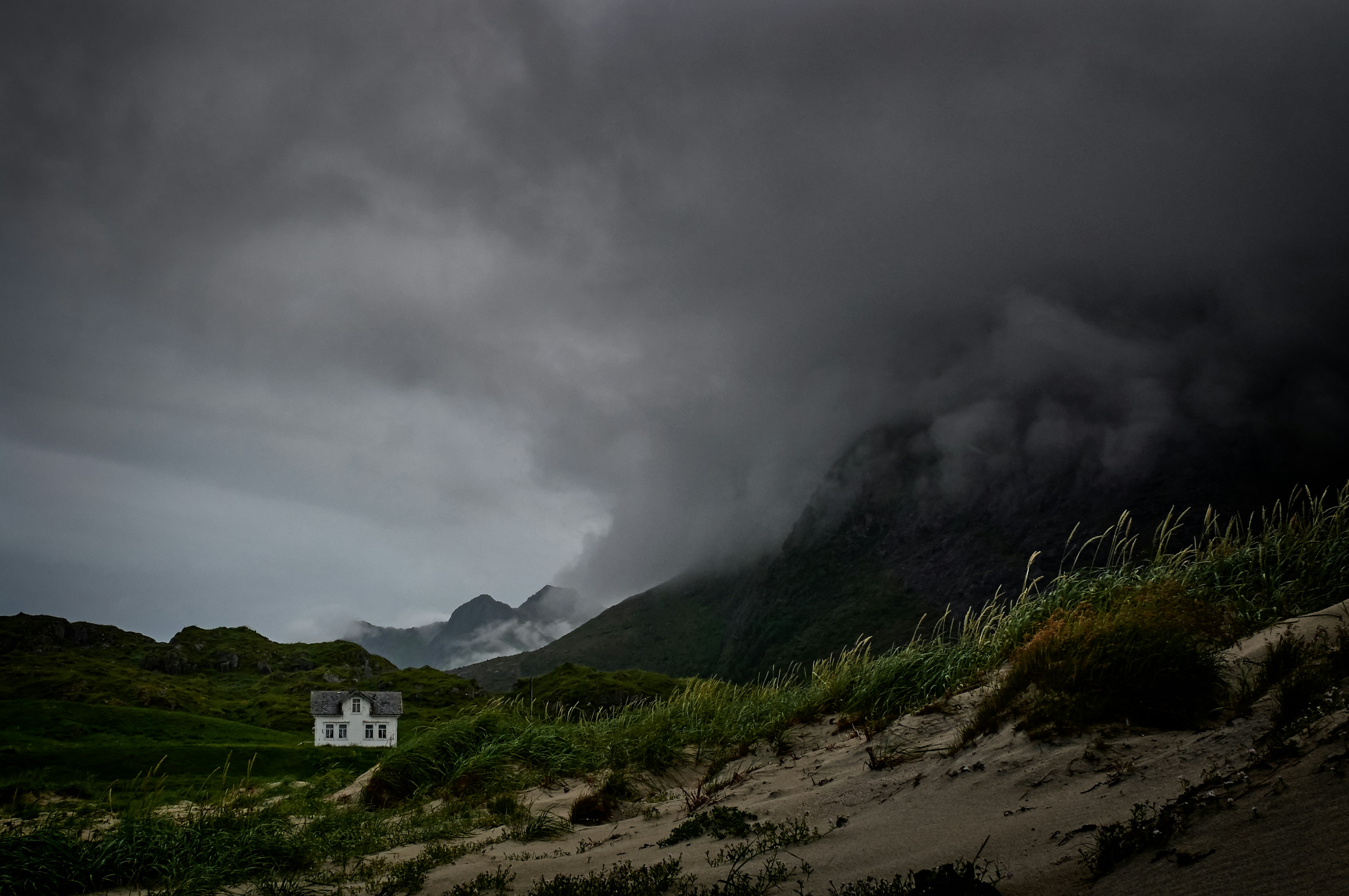 Isolated House in Stormy Mountains