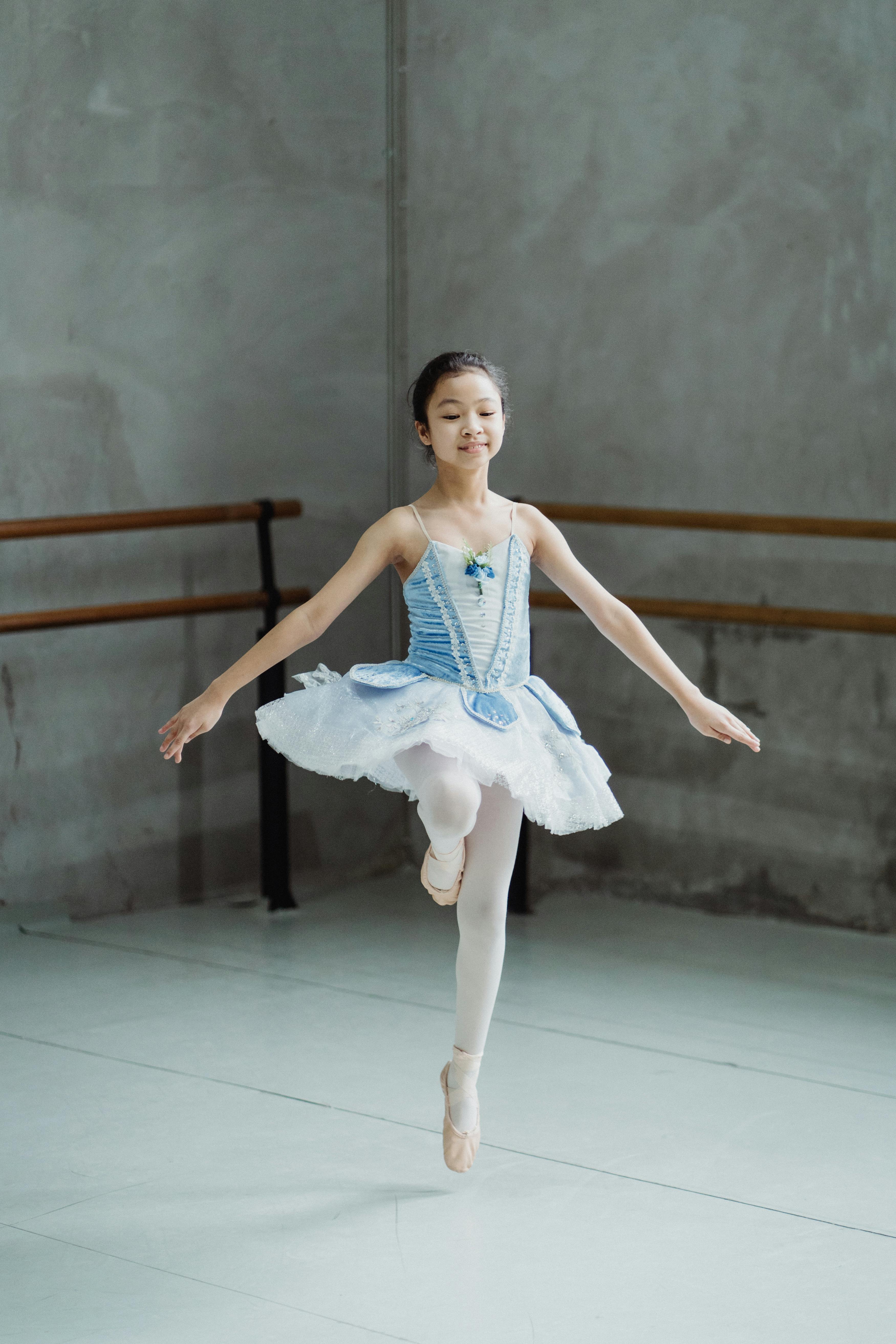 Young Ballerina Practicing in Studio
