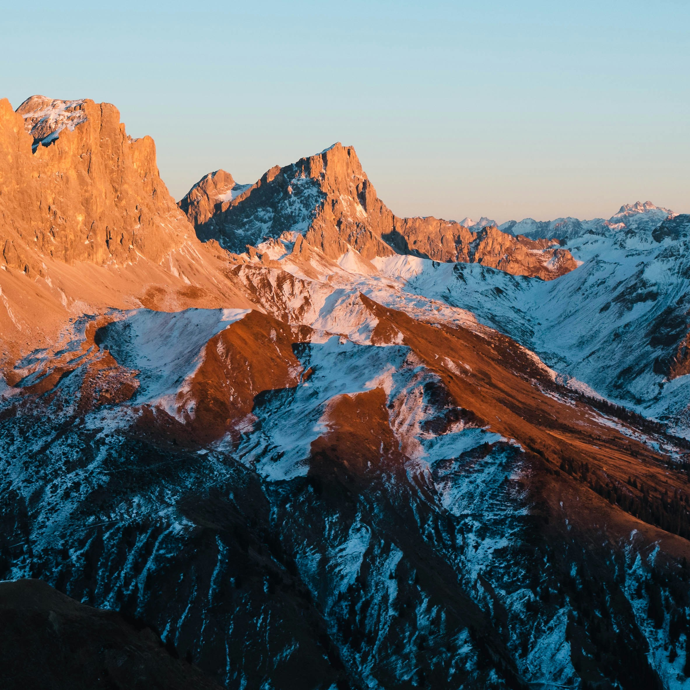 Sunlit Snow-capped Mountain Range