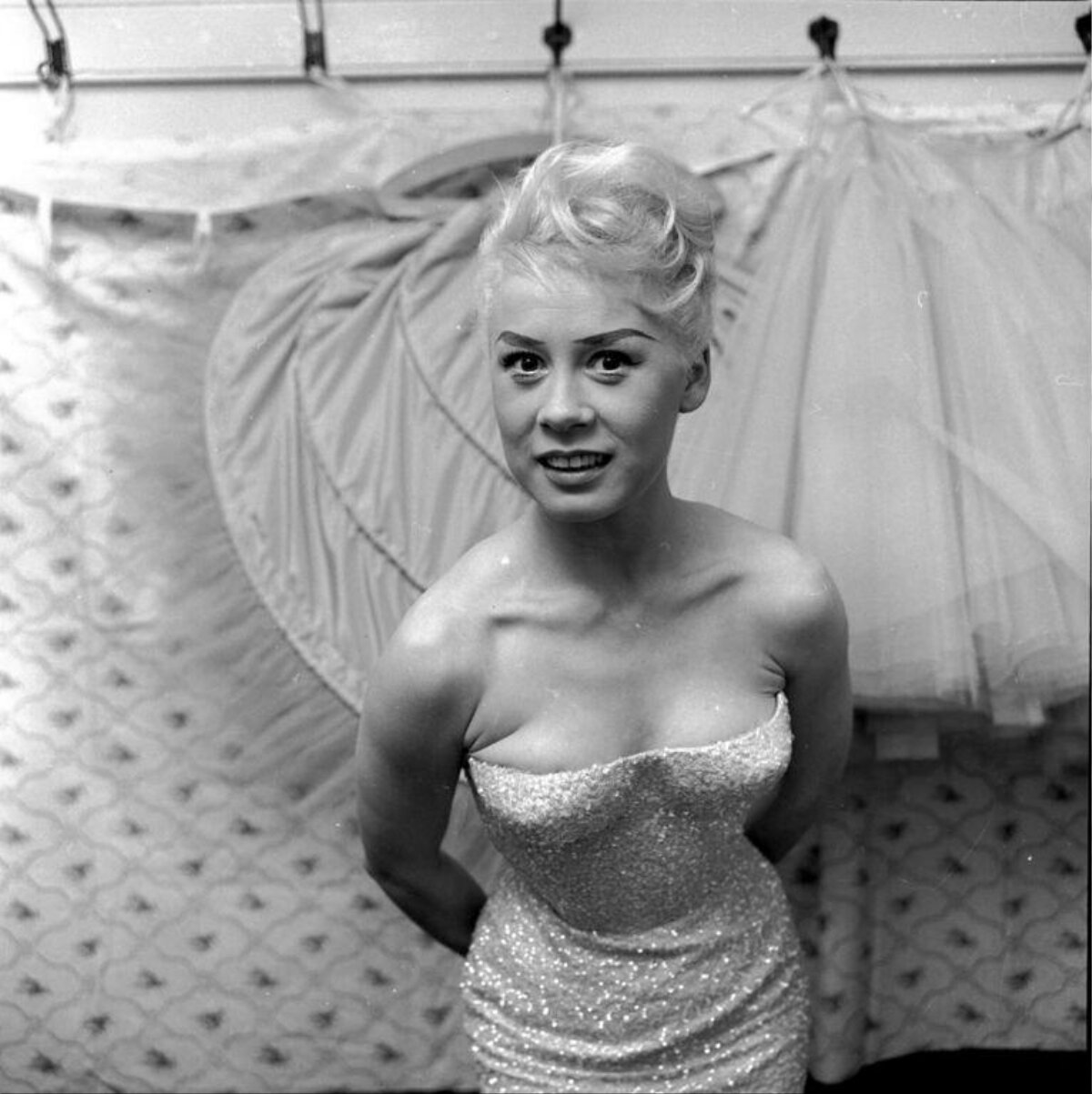 Blonde Performer Backstage With Costumes