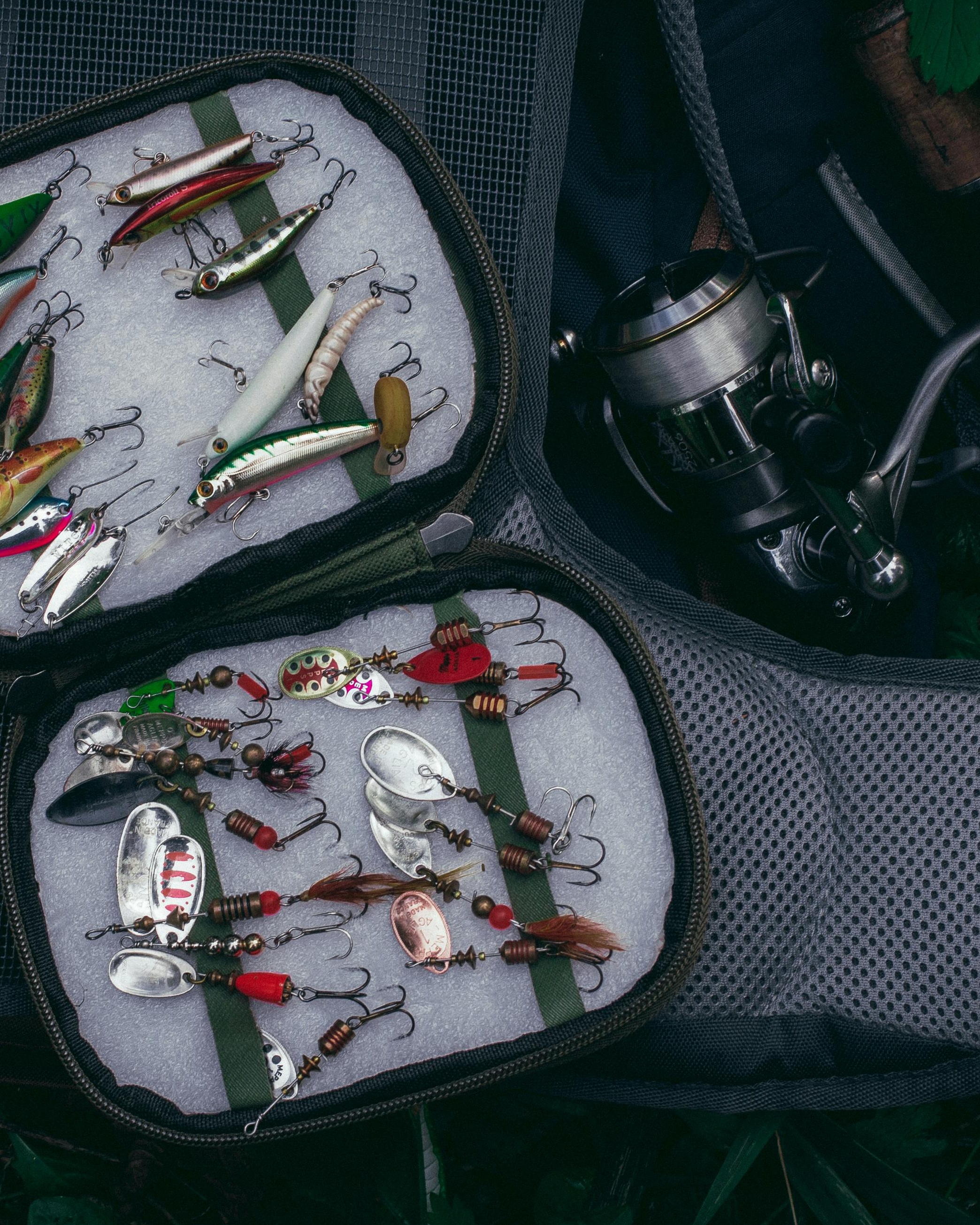 Fishing Lures and Reel in Tackle Bag