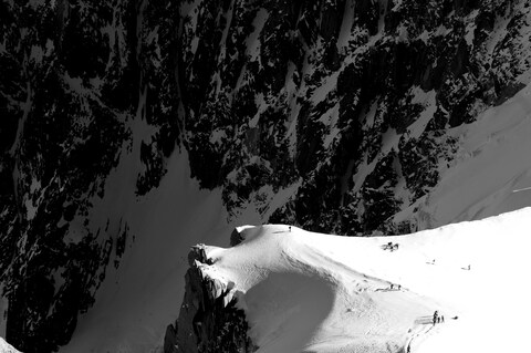 Climbers on Snowy Mountain Ridge