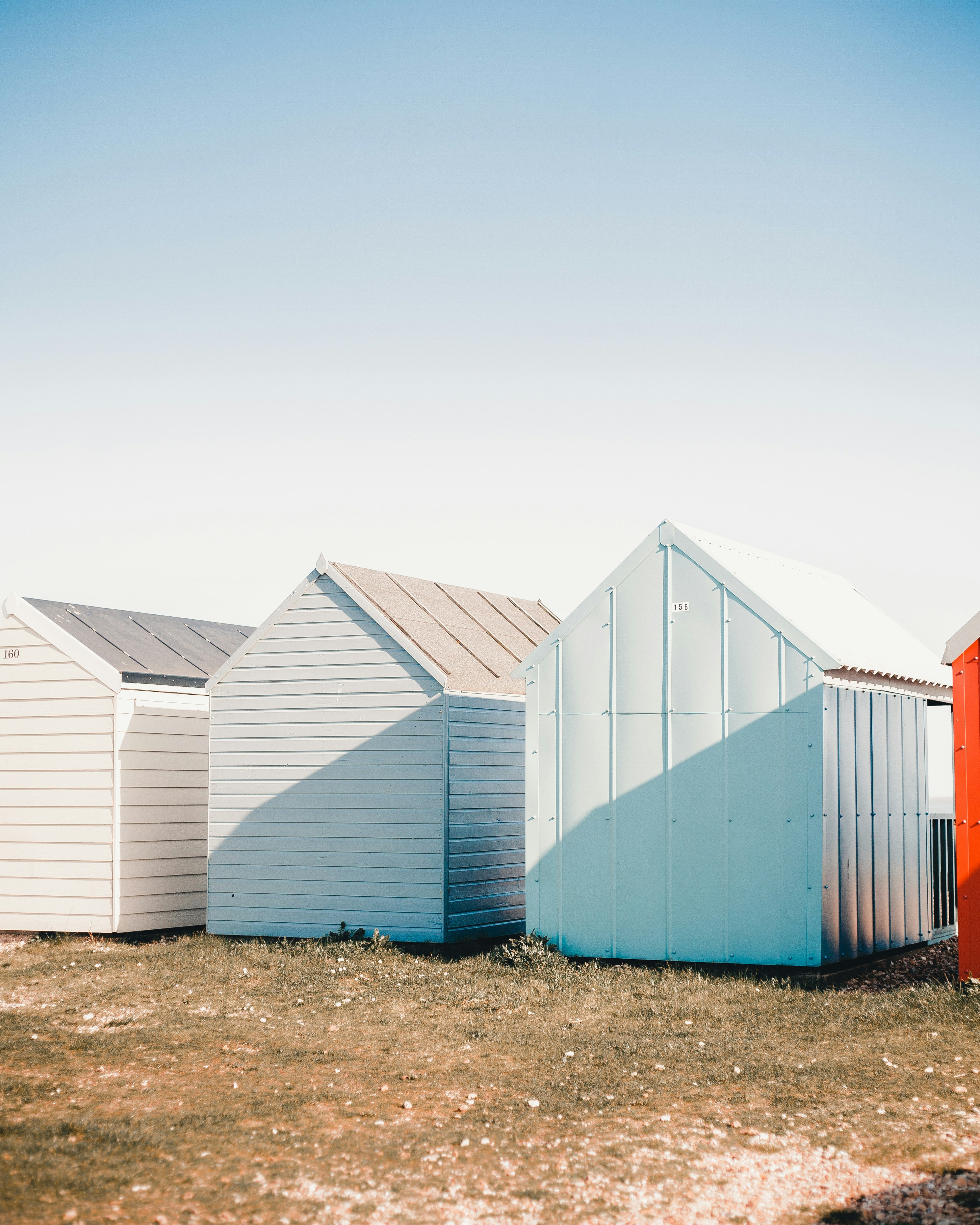 Colorful Beach Huts on Grass