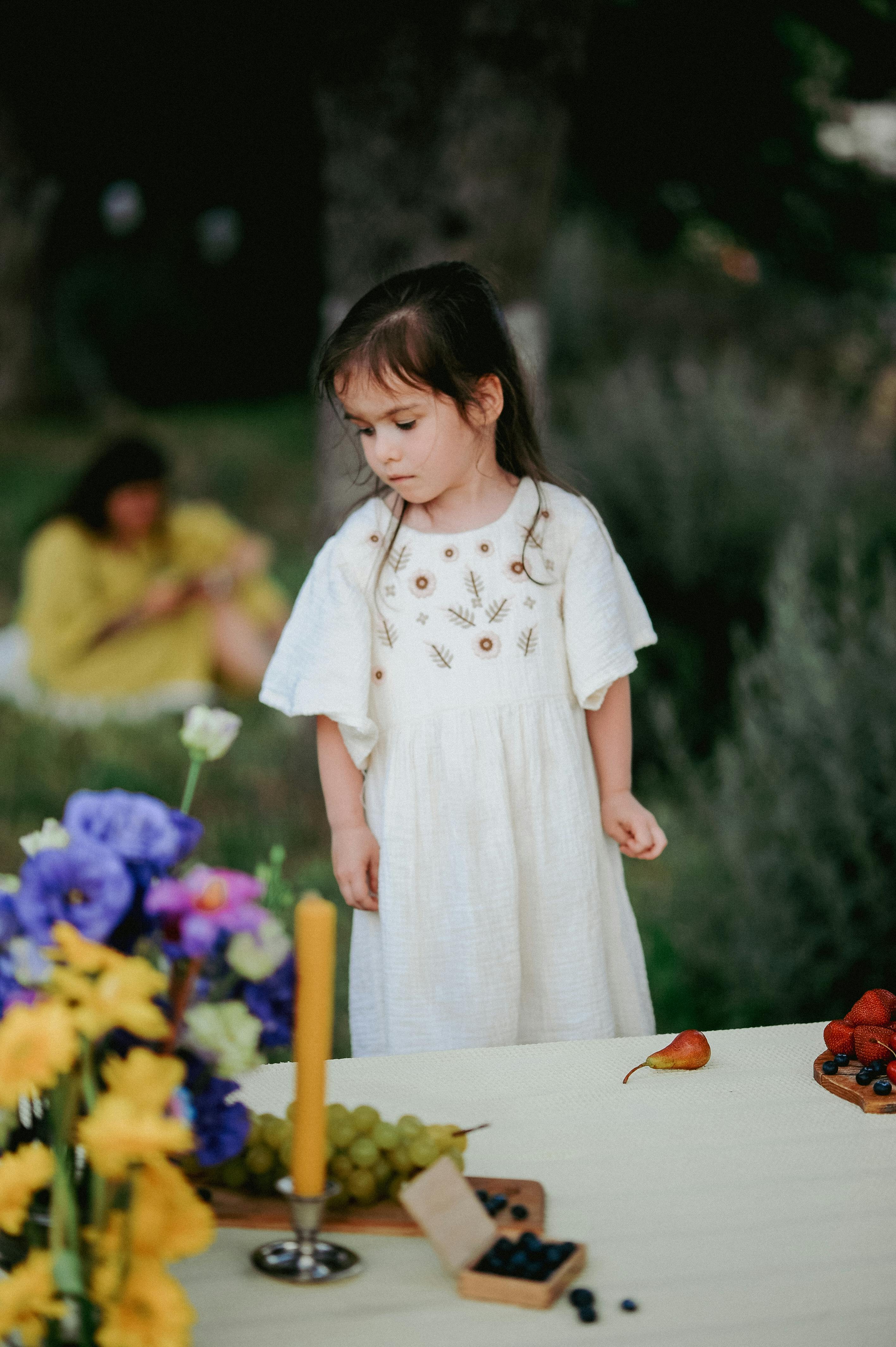Little Girl at Outdoor Picnic Table