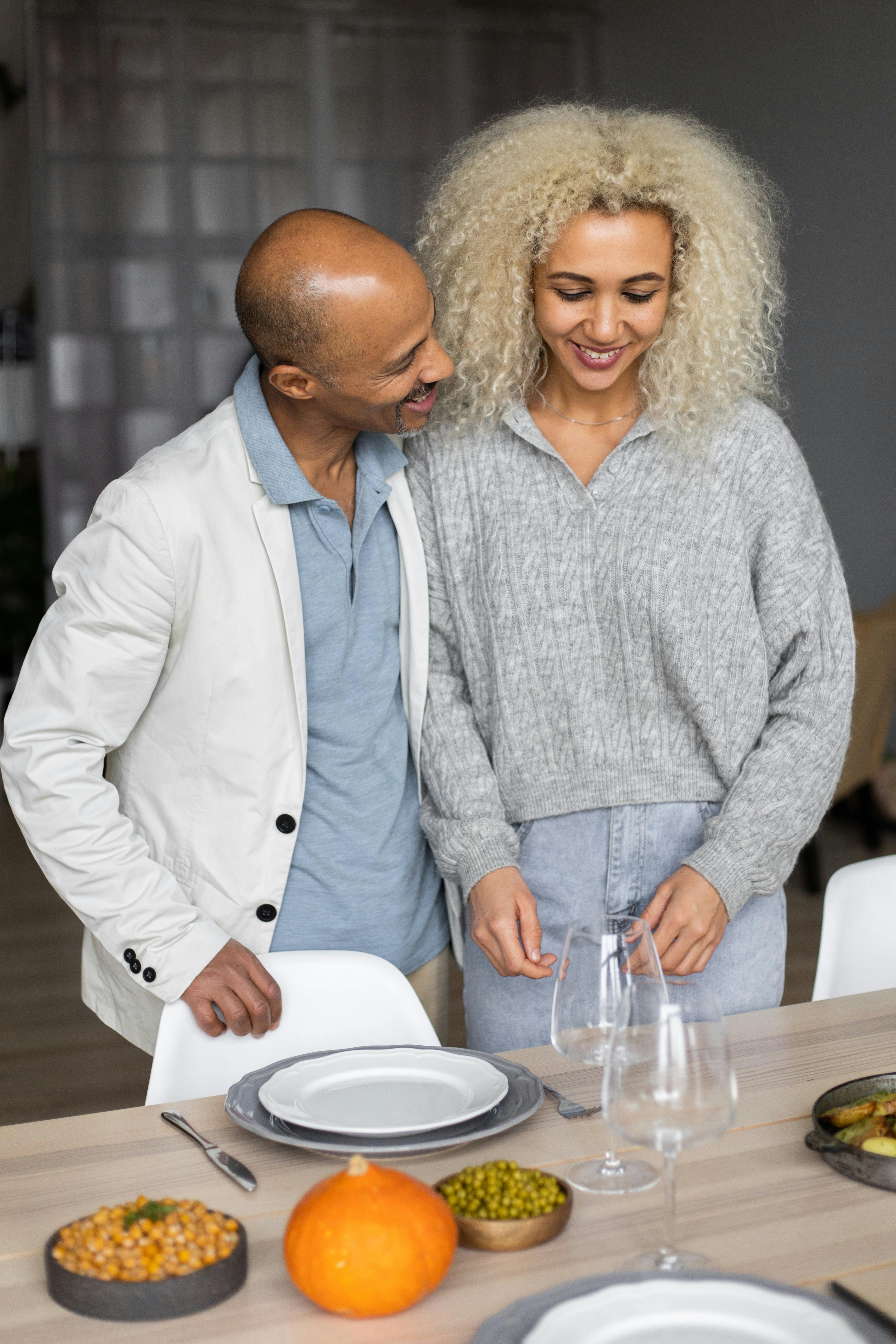 Couple Preparing Holiday Dining Table