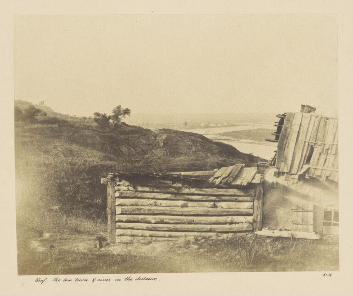 Old Huts Overlooking Distant River