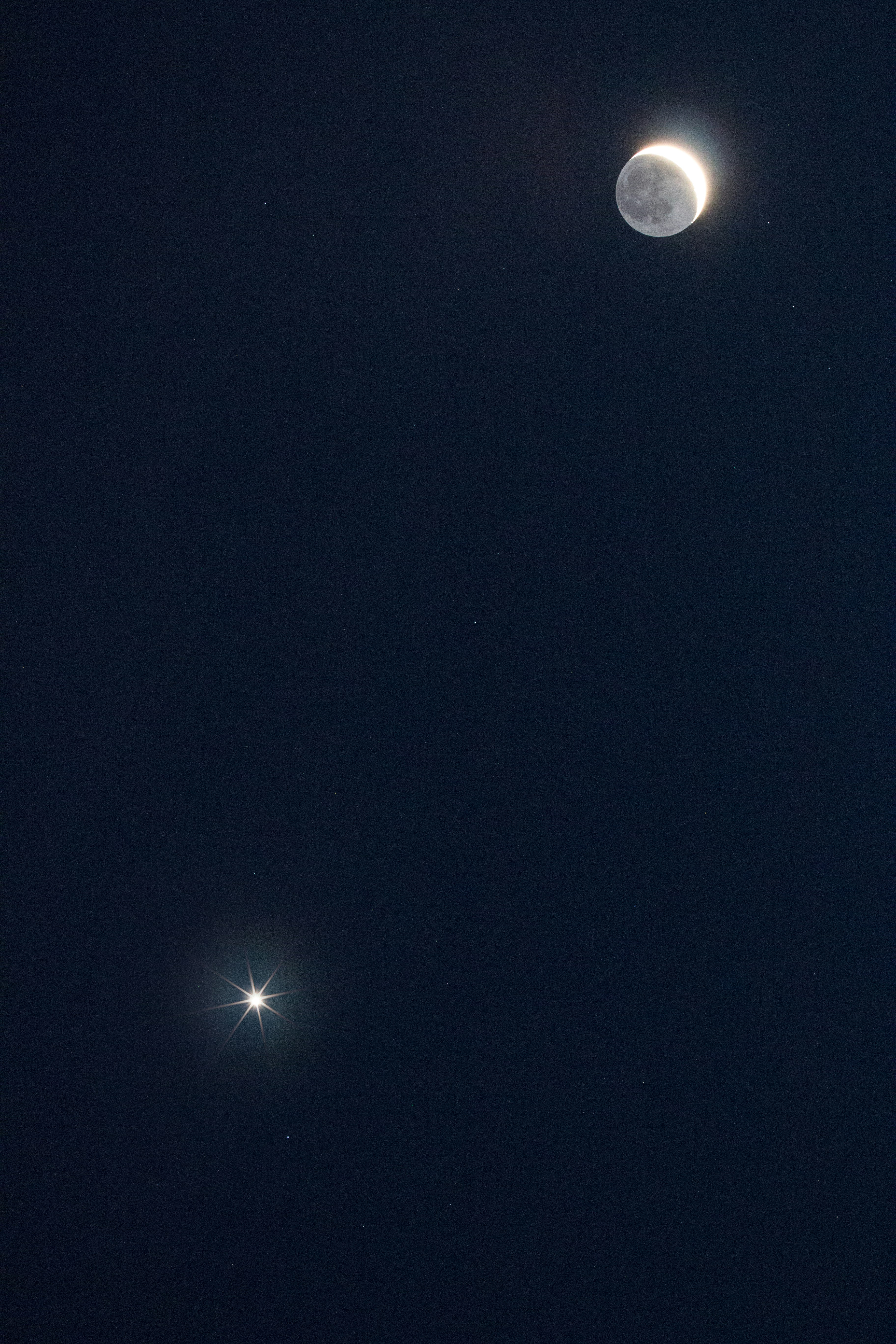 Crescent Moon and Bright Star in Night Sky
