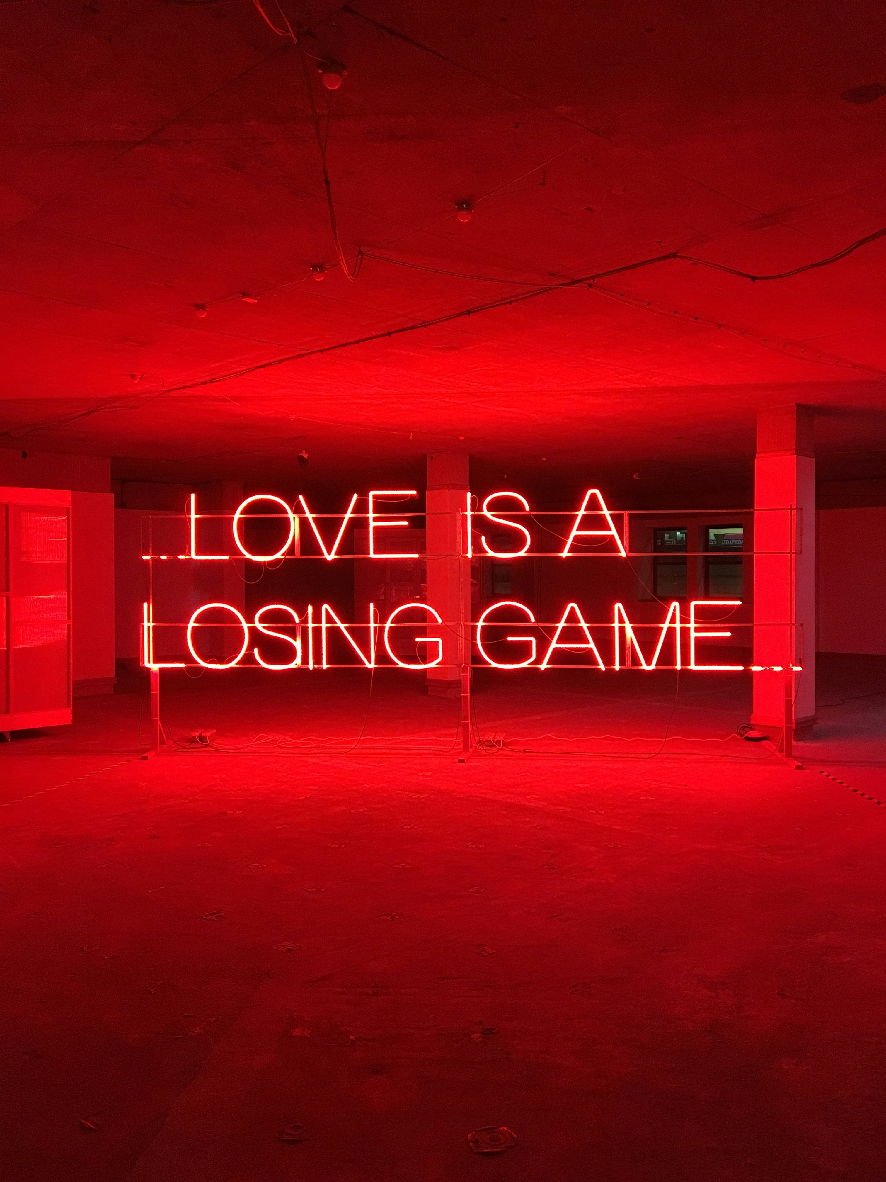 Red Neon 'Love Is A Losing Game' Installation