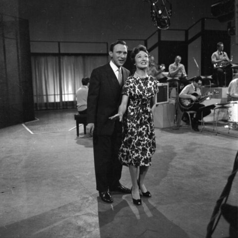 Couple Performing in Vintage TV Studio