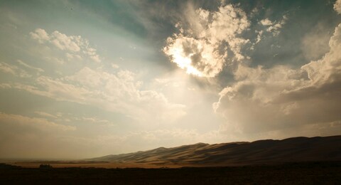 Sunlit Desert Sand Dune Landscape