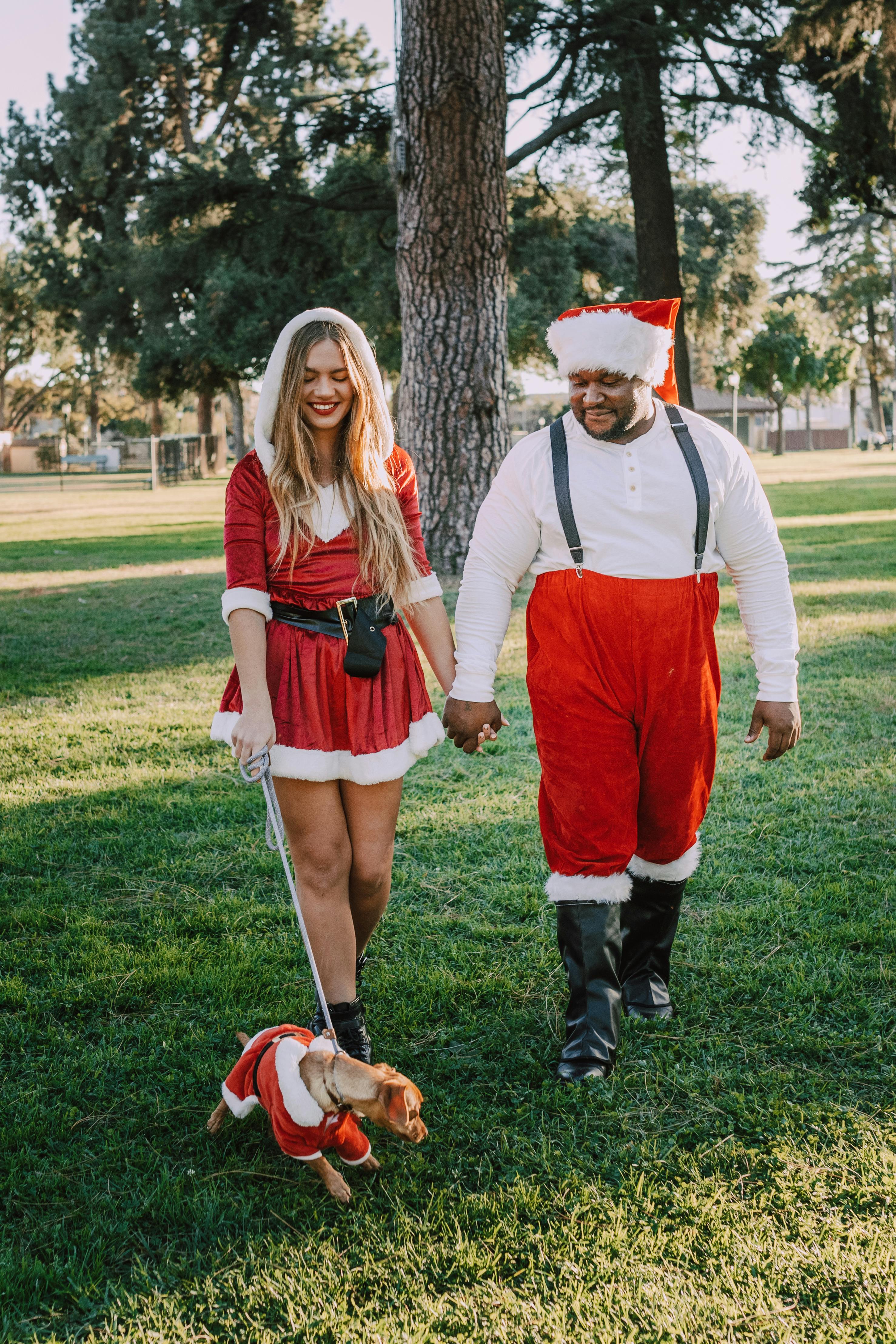 Couple and Dog in Christmas Costumes Walk in Park — Funny