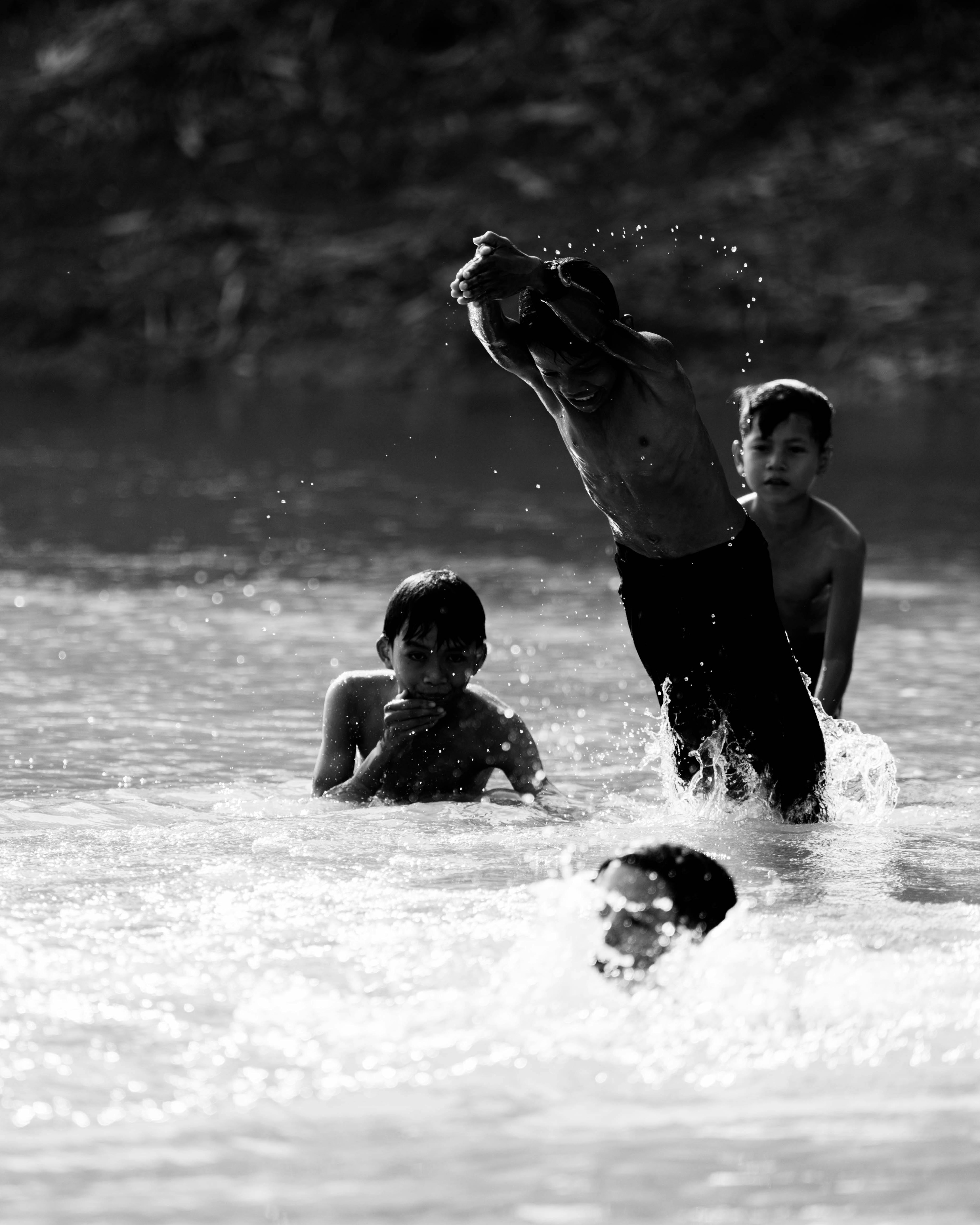 Boys Playing in River Water