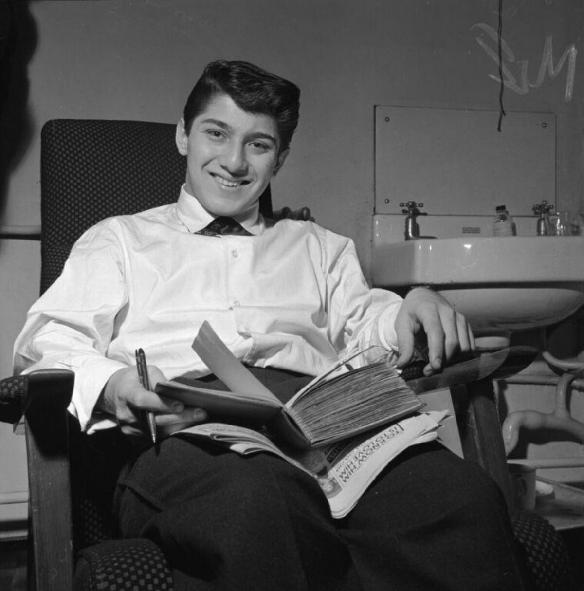 Young Student Studying in Armchair