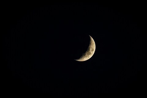 Crescent Moon In Night Sky