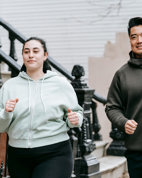 Two People Jogging Outdoors