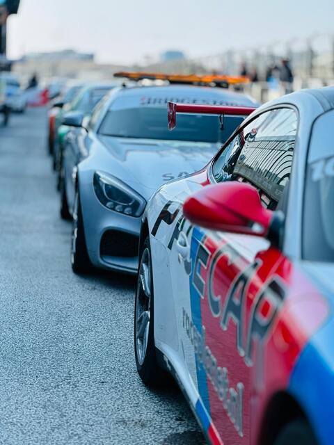 Race Cars Lined Up on Racetrack