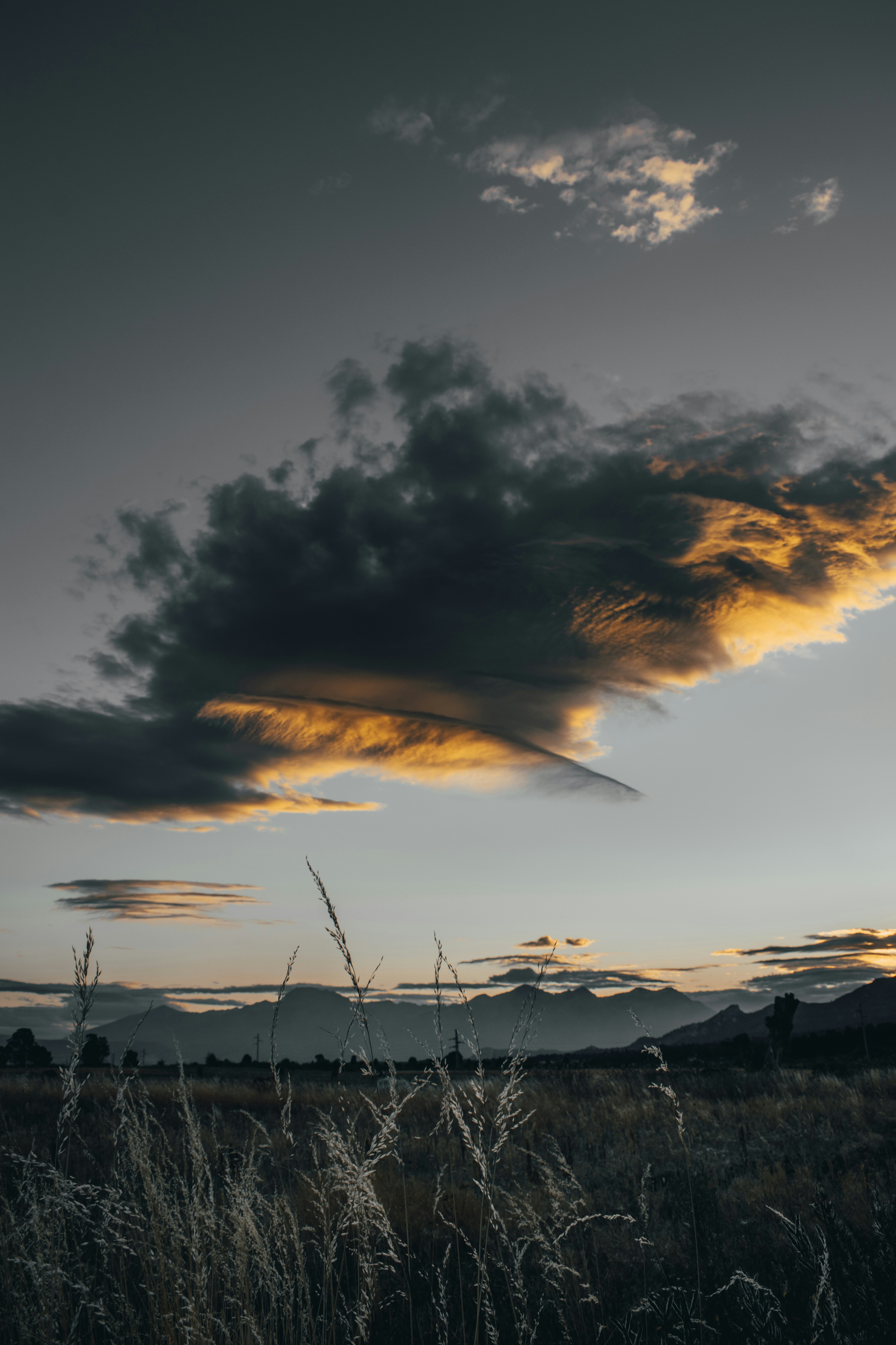 Sunset Cloud Over Grass Field