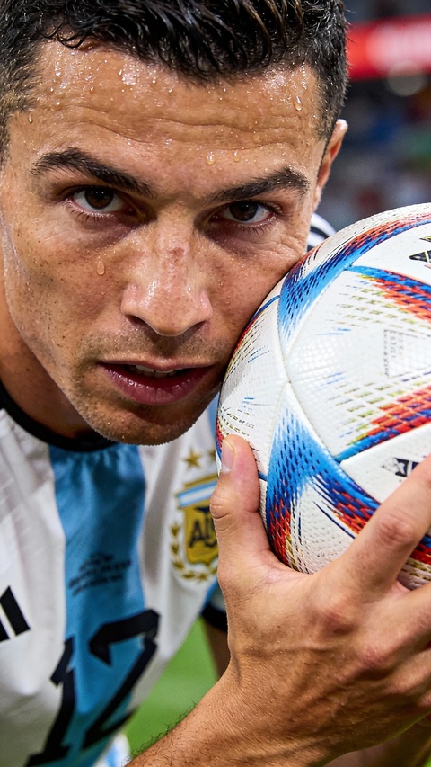 Cristiano Ronaldo Holding Soccer Ball