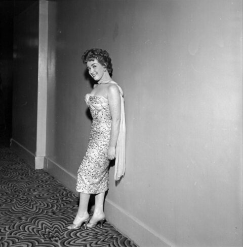 Vintage Woman Posing in Corridor