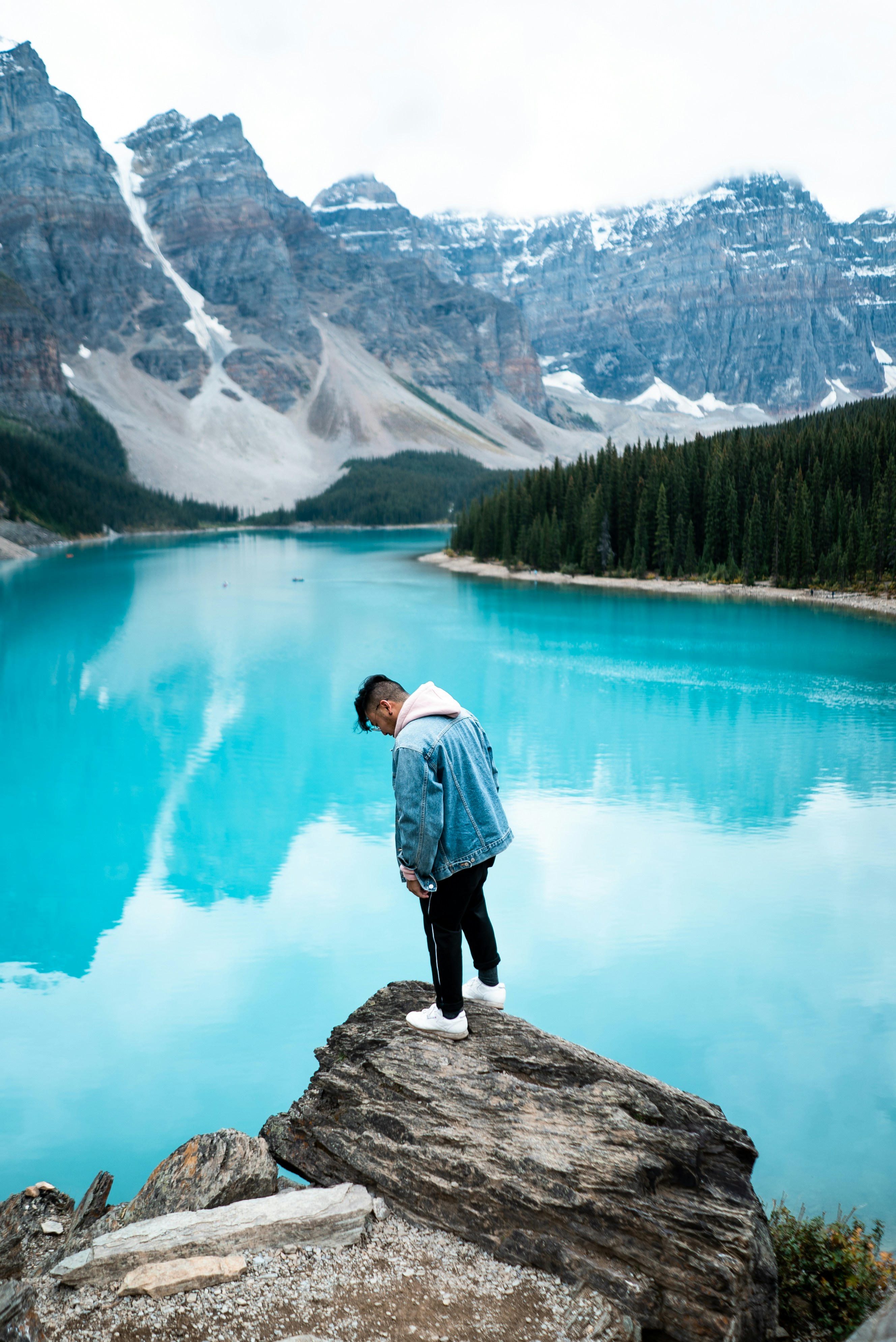 Man at Turquoise Mountain Lake