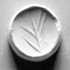 Round Clay Seal With Carved Symbol