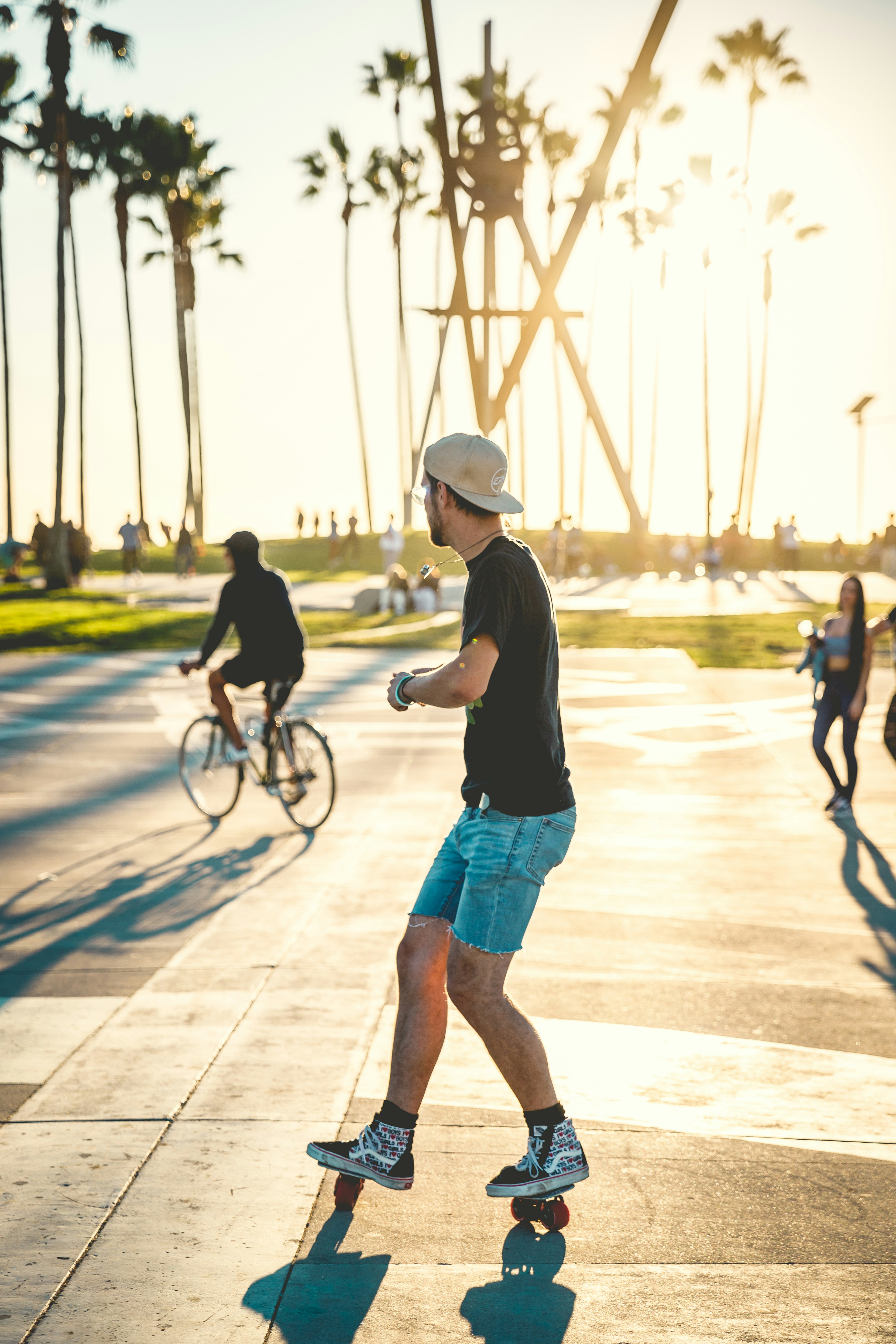 Man Skateboarding at Sunset Park