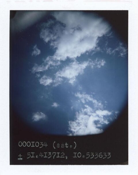 Cloudy Sky with Coordinate Text