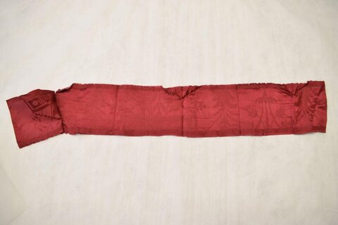 Red Fabric Strip on Plain Background