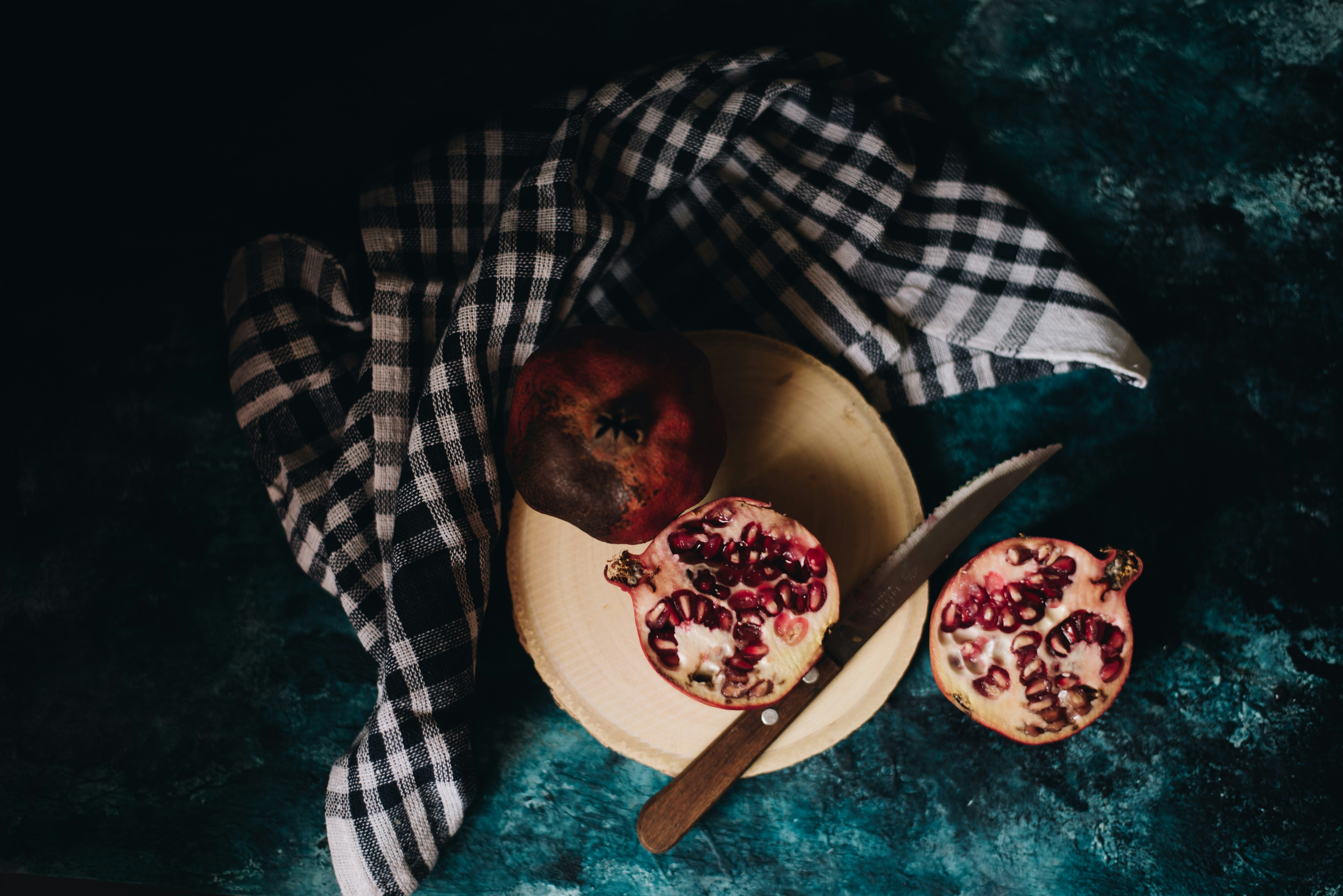 Sliced Pomegranates on Cutting Board — Fruit Encyclopedia