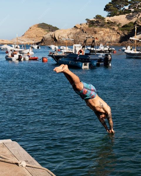 Man Diving Into Sea From Dock