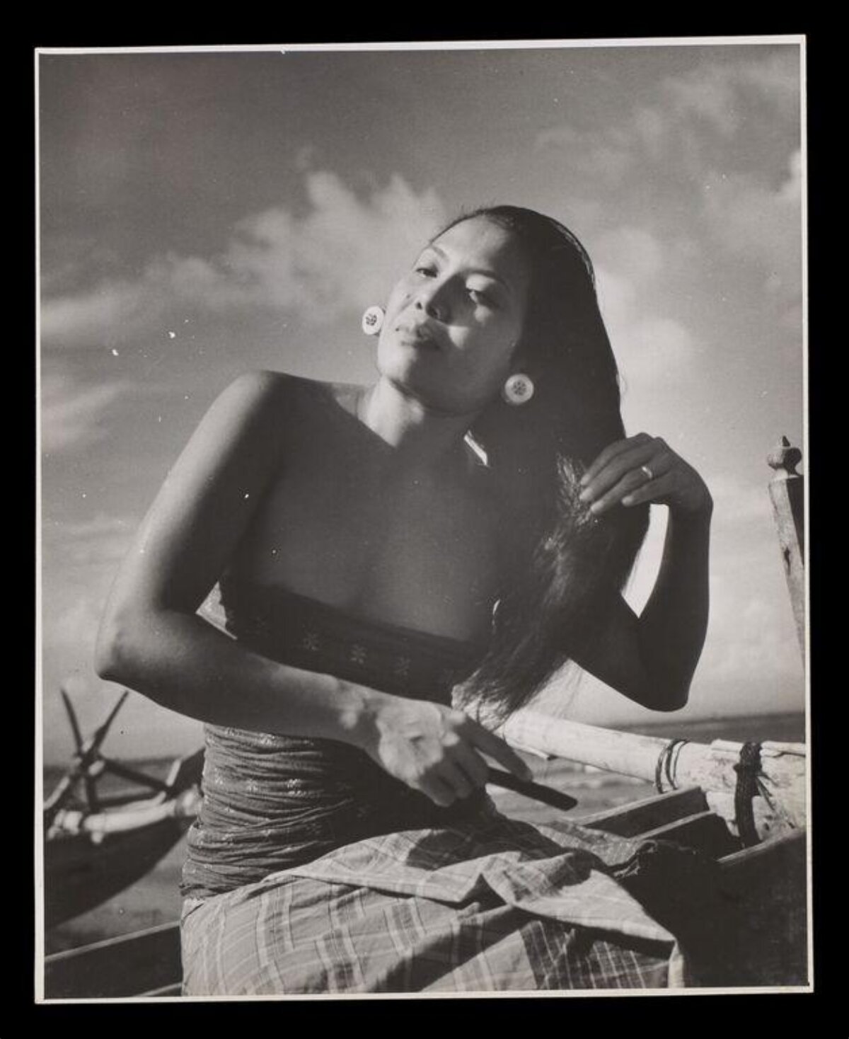Woman on Boat by the Sea