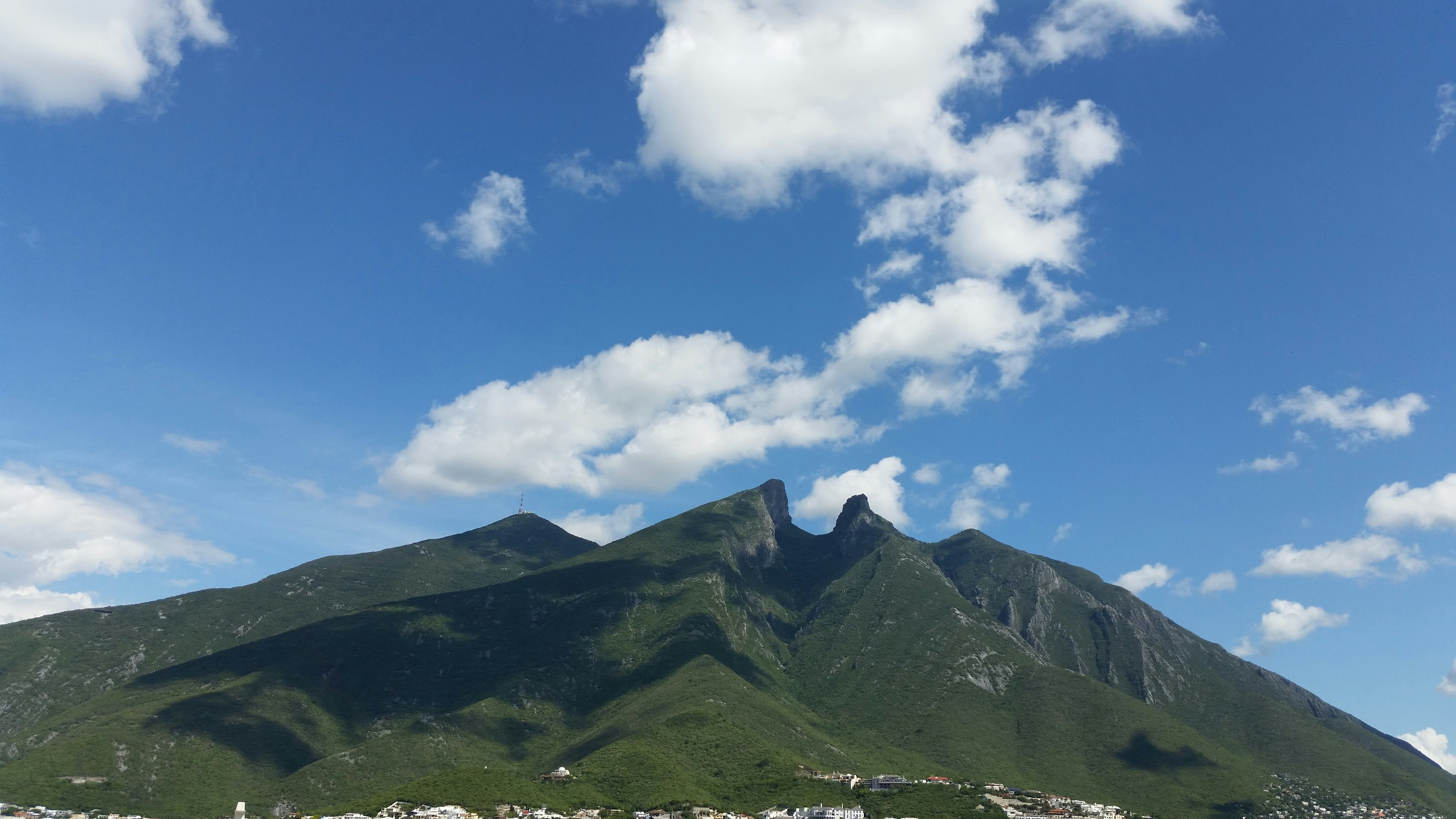 Green Mountain Under Blue Sky With Clouds