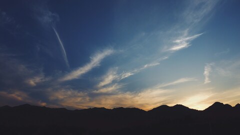 Sunset Sky Over Mountain Range
