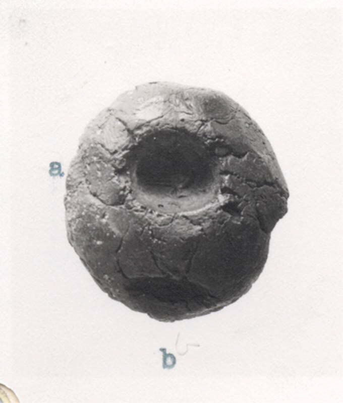 Archaeological spherical clay artifact