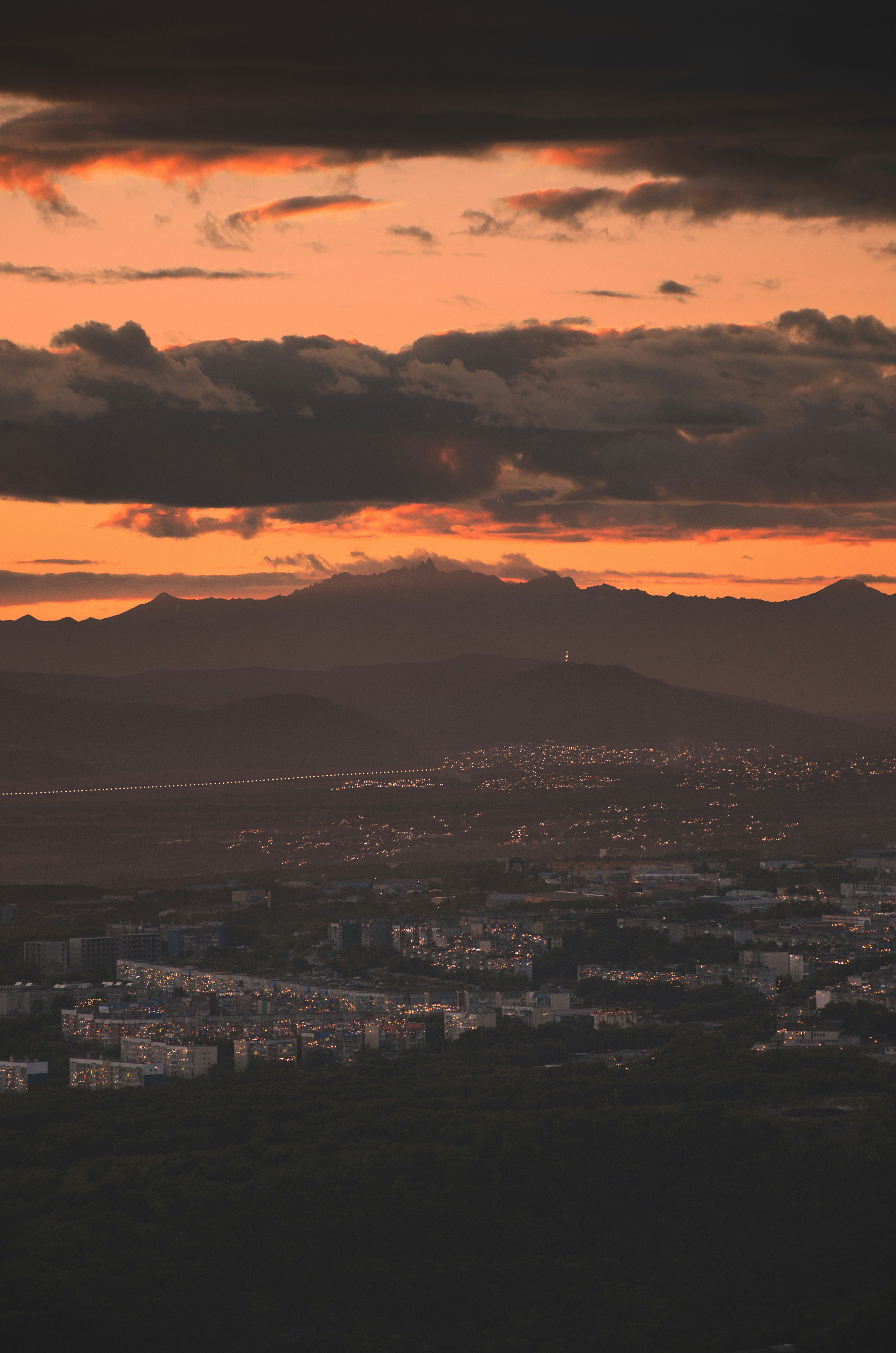 Sunset City View with Mountains