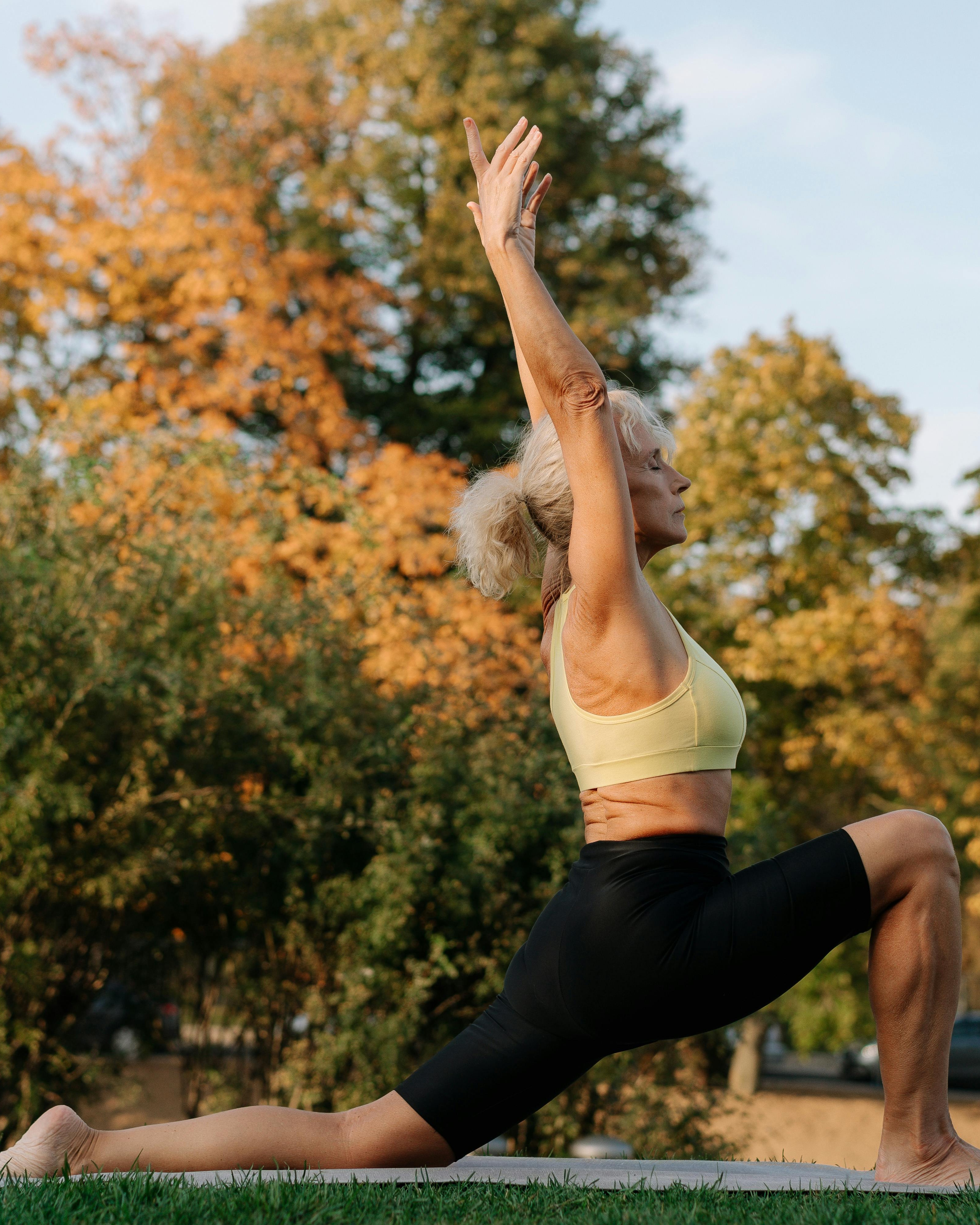 Senior Woman Doing Yoga Outdoors