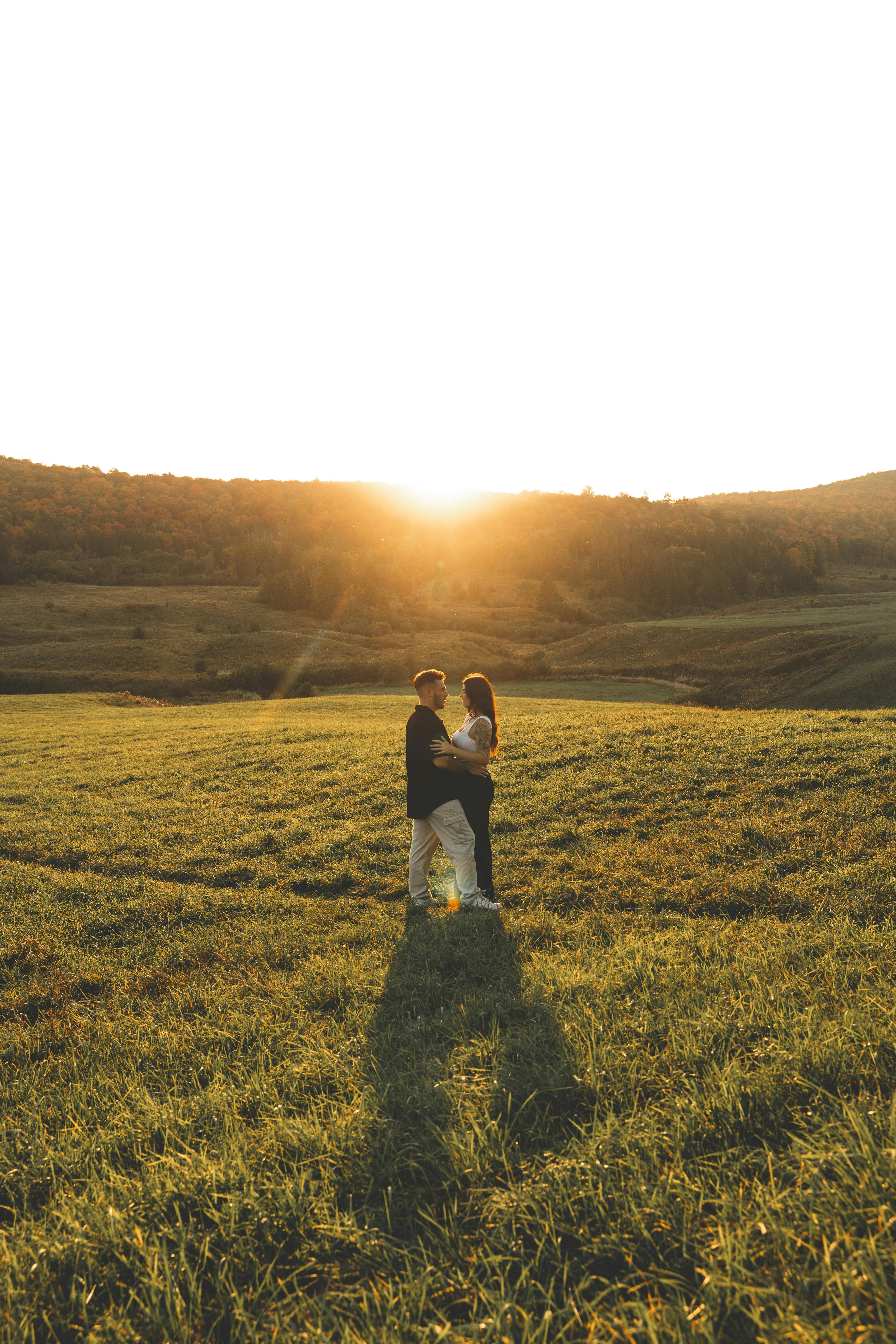 Couple Embracing in Sunset Field