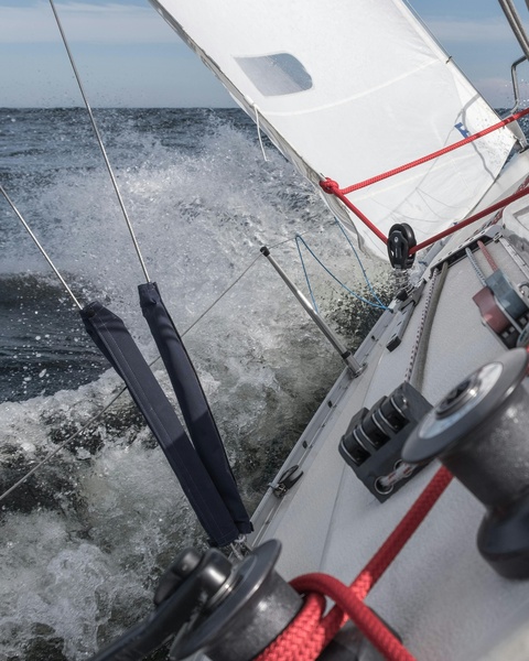 Sailboat Heeling Through Choppy Open Sea